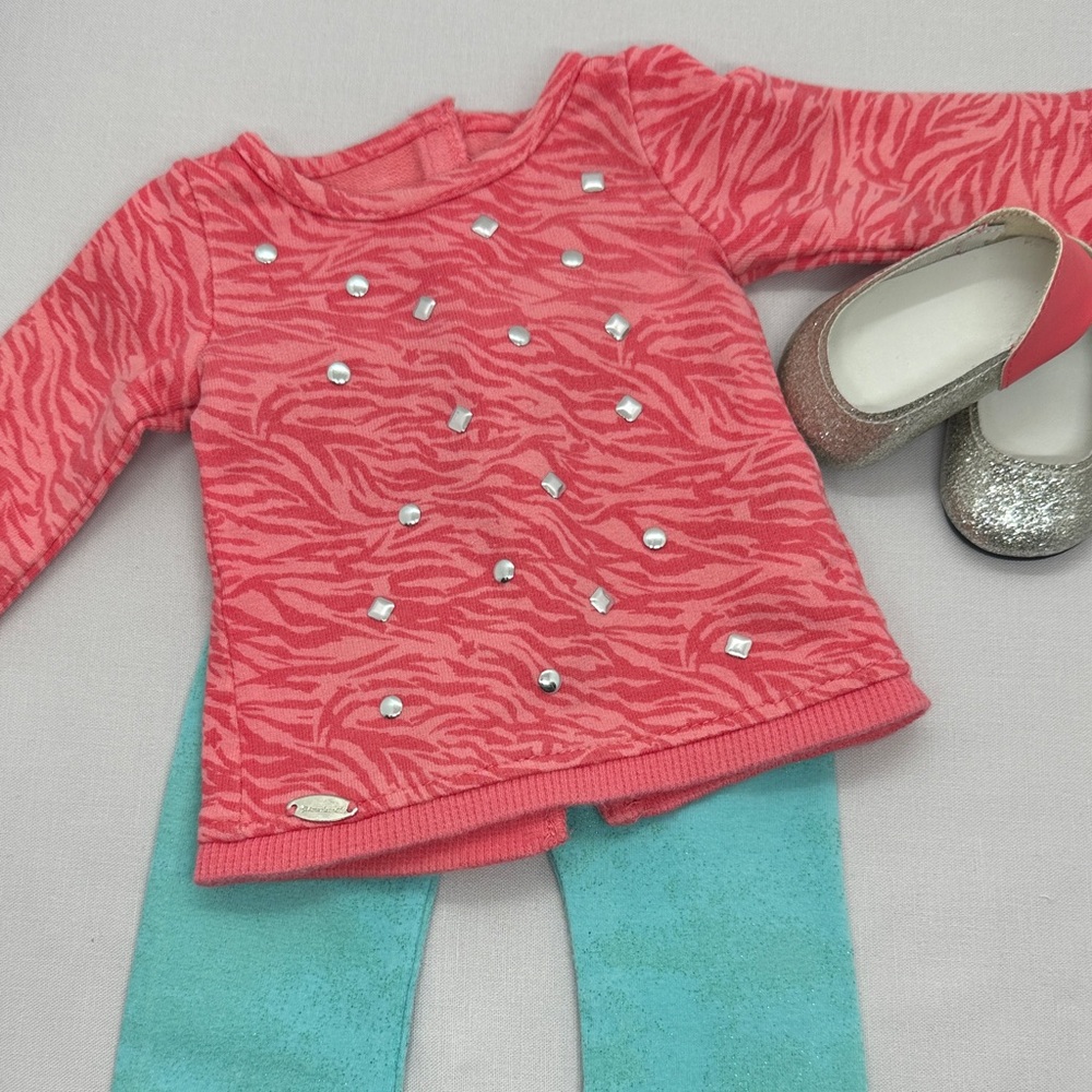 American Girl Coral Zebra Print Sweater with Blue Leggings and shoes.  Retired.